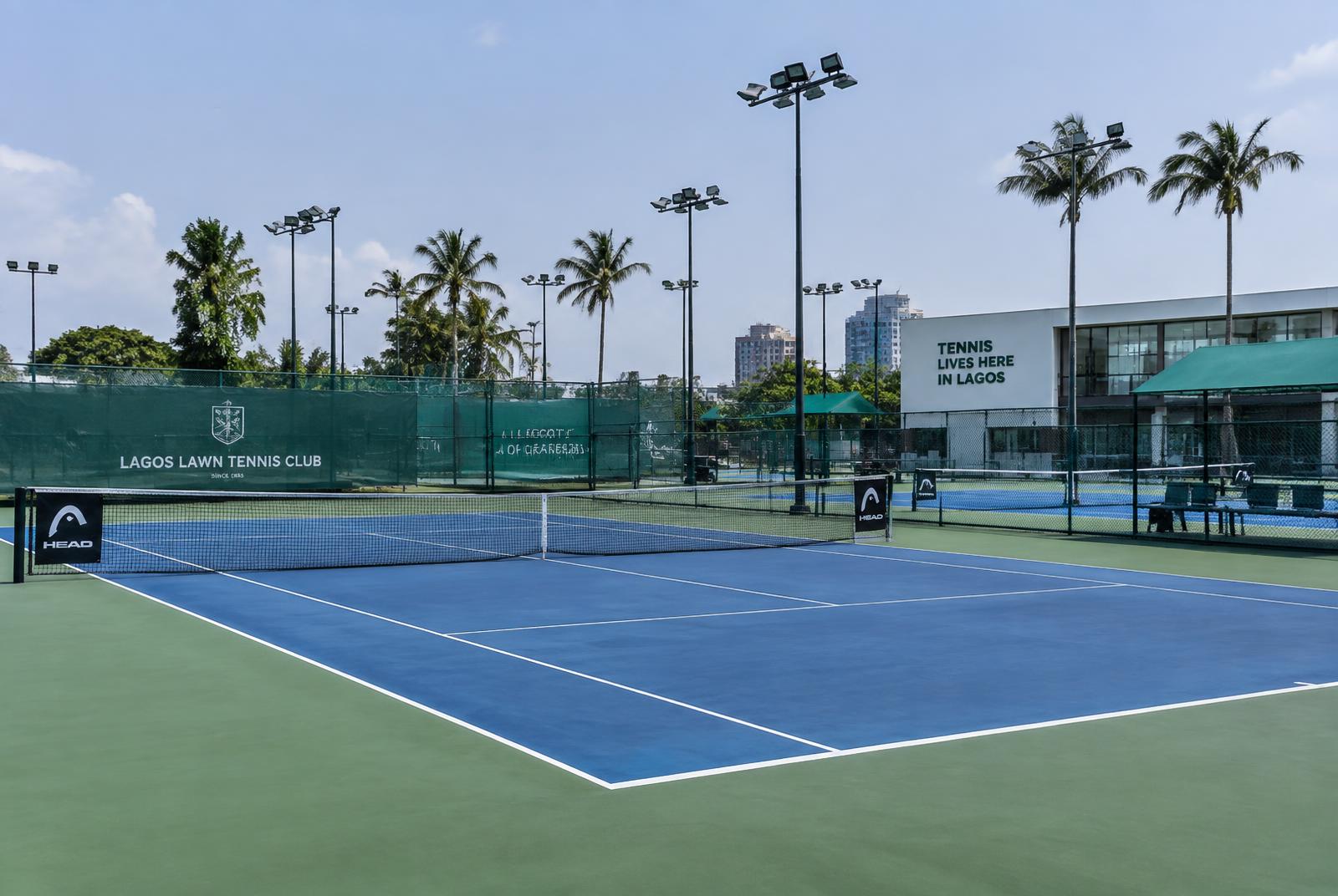 Outdoor hard tennis courts with floodlights at a Lagos tennis centre
